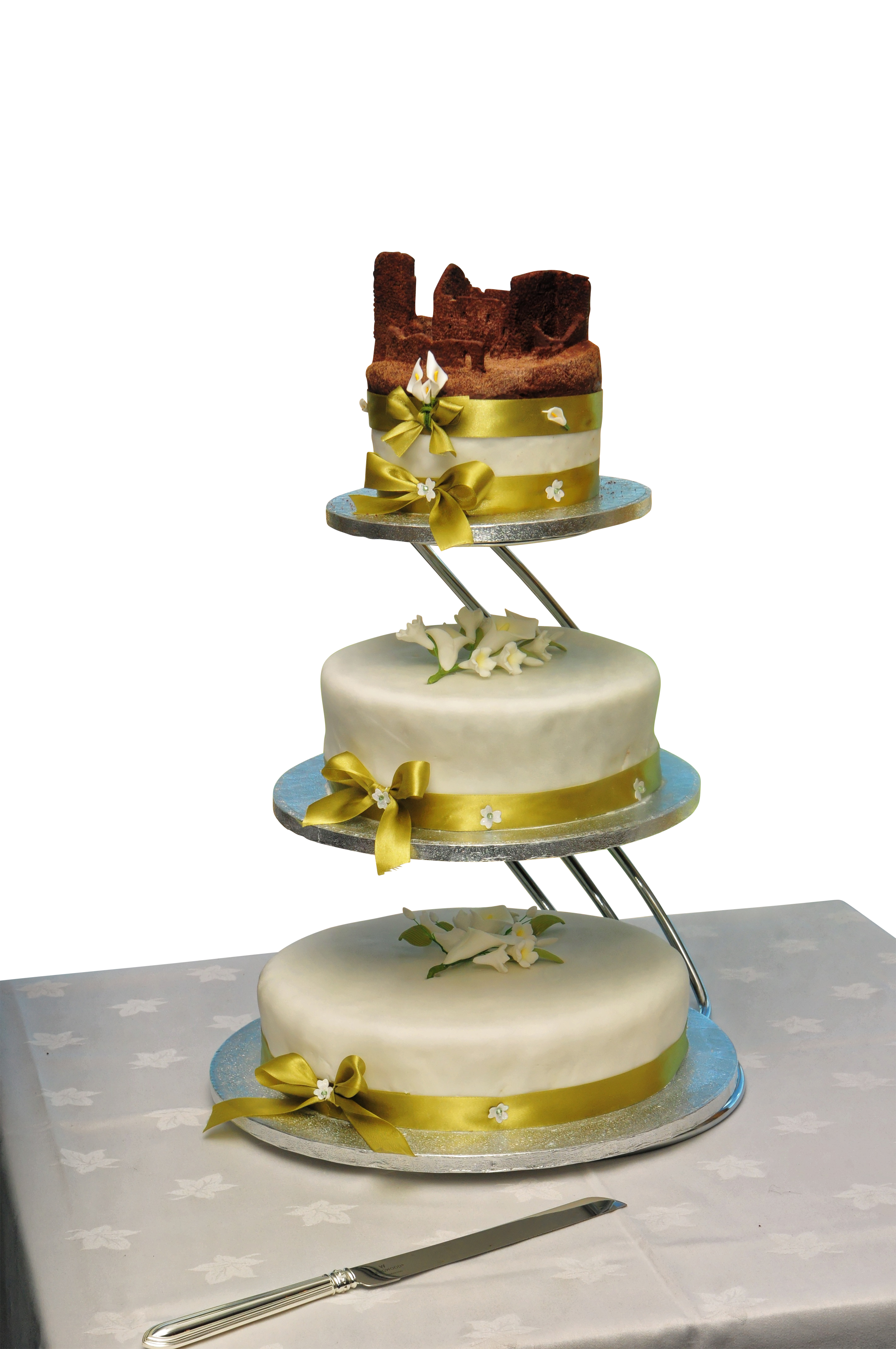 A Cake With A Gold Ribbon PNG