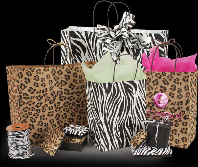 A Group Of Bags With Zebra Print And Ribbon PNG