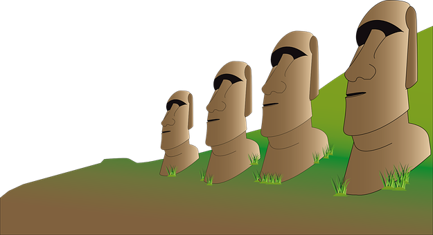 A Group Of Stone Statues In Grass