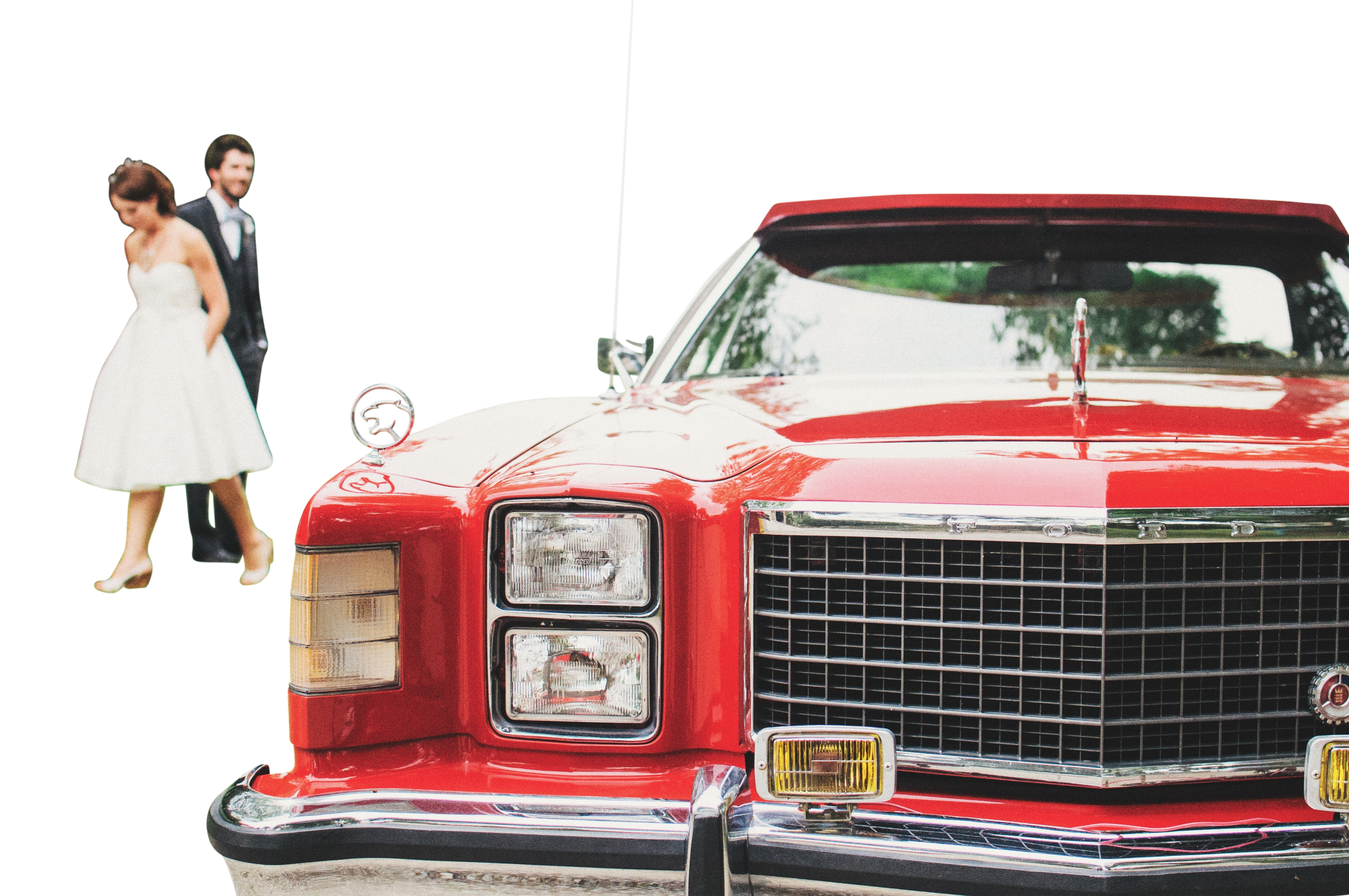 A Man And Woman Standing Next To A Red Car PNG