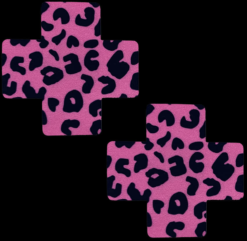 A Pink And Black Cross With Black Spots PNG