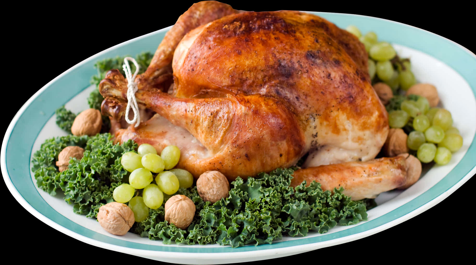 A Turkey On A Plate With Grapes And Kale PNG