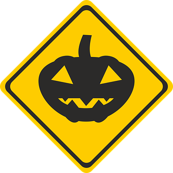 A Yellow Sign With A Pumpkin Face PNG